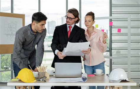 Team Of Male And Female Engineers And Architects Working Team Meeting