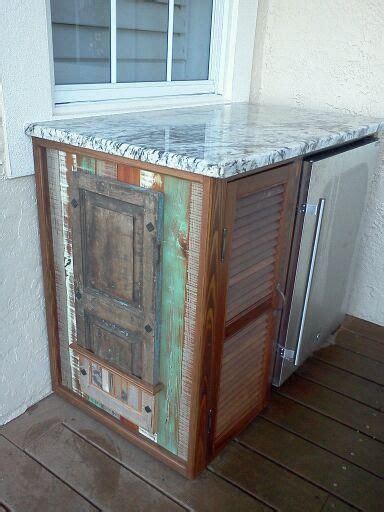 For smaller spaces, try one of the projects with just a sink and prep counter for you to mix drinks or put the finishing touches on your food. Outdoor bar cabinet: repurposed shutters and wood w ...