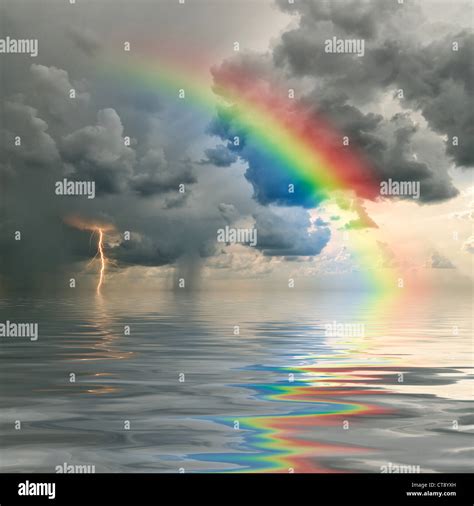Colorful Rainbow Over Ocean Thunderstorm With Rain And Lightning On