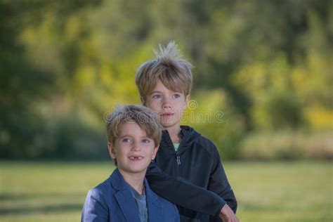 Portrait Of Two Boys With A Blurred Background Stock Image Image Of