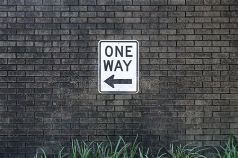 One Way Sign Posted On A Brick Wall Stock Image Image Of Wall