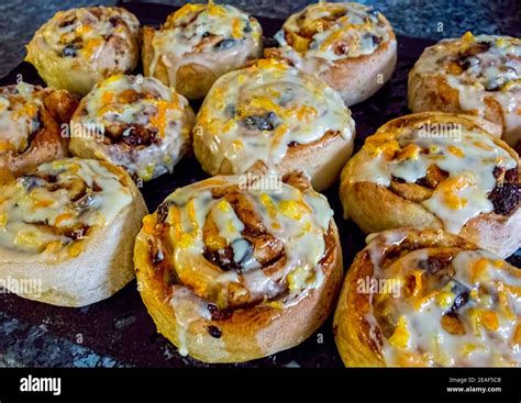 Chelsea Buns With Orange Zest Icing Stock Photo Alamy