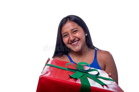 Black Woman Delivering A T Latina Girl With Straight Hair Giving A Christmas Present Stock
