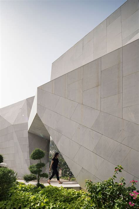 Agi Architects Rock House Wrapped In Origami Like Stone Facades