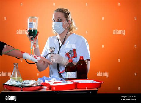 Exhausted Nurse Patient With Bandaged Wrist Gets Infusion Germany