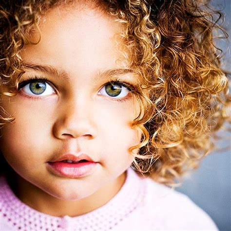 Beautiful Girl With Naturally Curly Hair And Green Eyes