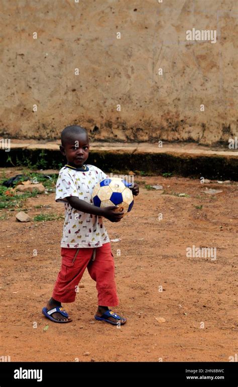 Burkinabe Boy Holding His Football In A Small Village In Central