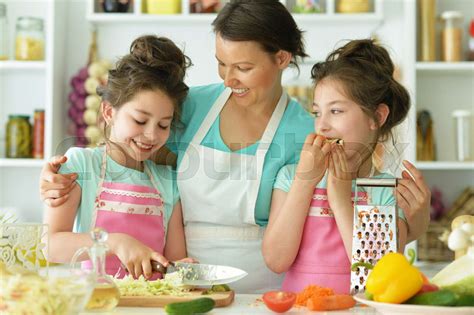 Mom And Daughters Cook Stock Image Colourbox