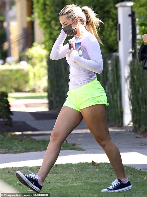 addison rae showcases her dancer s legs in neon shorts after a pilates class with pal shanina