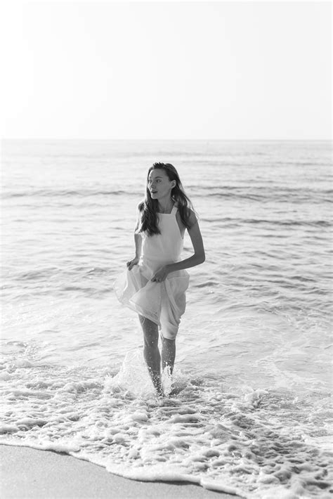 Woman In White Dress Walking On Sea Water · Free Stock Photo