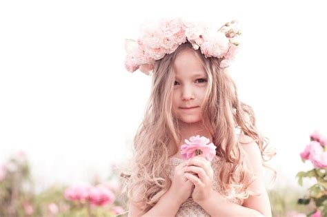 Premium Photo Cute Baby Girl Holding Flower Rose Outdoors