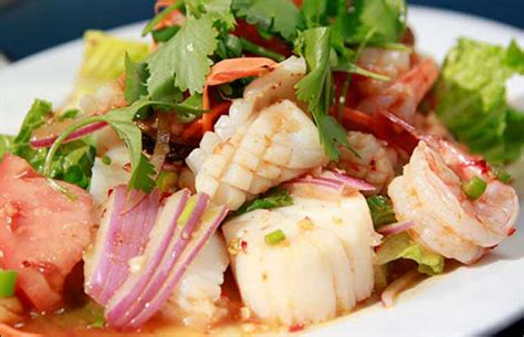 4 of 19 khanom jeeb (pork and shrimp dumplings) Spicy Thai Seafood Salad