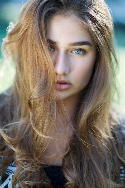 Beautiful Young Girl With Blue Eyes And Long Hair Outdoors By Maja Topcagic