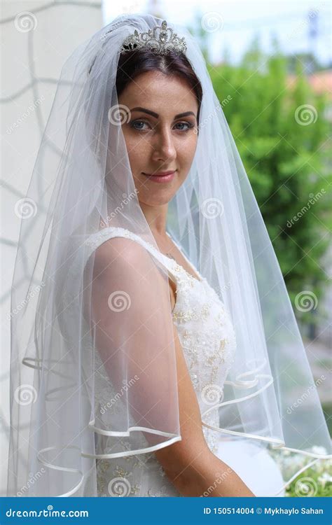 Beautiful Bride In Fashion Wedding Dress On Natural Background The