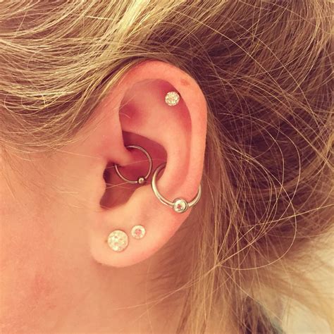 image result for helix conch and daith piercing earings piercings different ear piercings