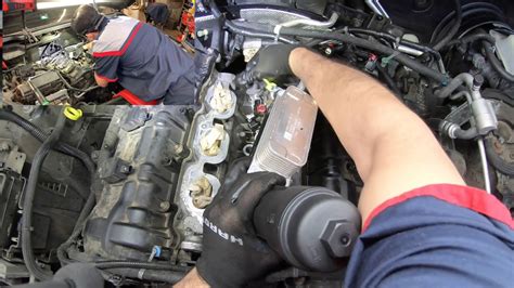 2011 Jeep Grand Cherokee 3 6L Oil leak and coolant leak under intake