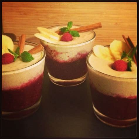 Three Glasses Filled With Different Types Of Desserts And Garnished