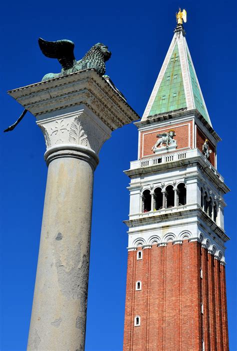 St Mark’s Bell Tower And Winged Lion Column In Venice Italy