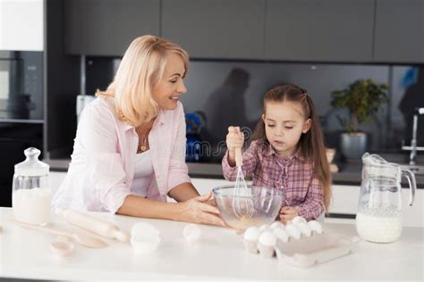 Grandmother Teaches Her Granddaughter How To Cook A Biscuit Stock Image Image Of Flat Cozy