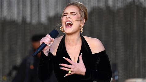 Adele Sparkles In Louis Vuitton And Schiaparelli Gowns At London Concert