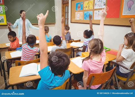 Pupils Raising Their Hands During Class Stock Photo Image Of Cute