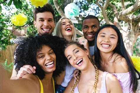 Happy Friends Taking A Selfie In A Summer Party By Stocksy