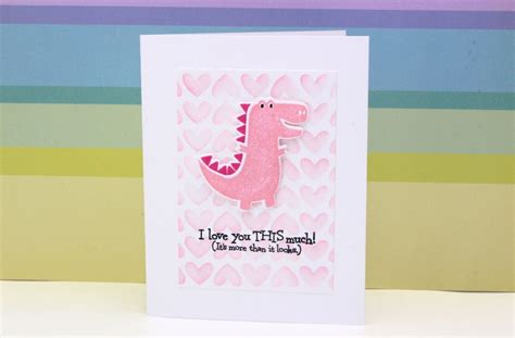 A Card With A Pink Dinosaur On It