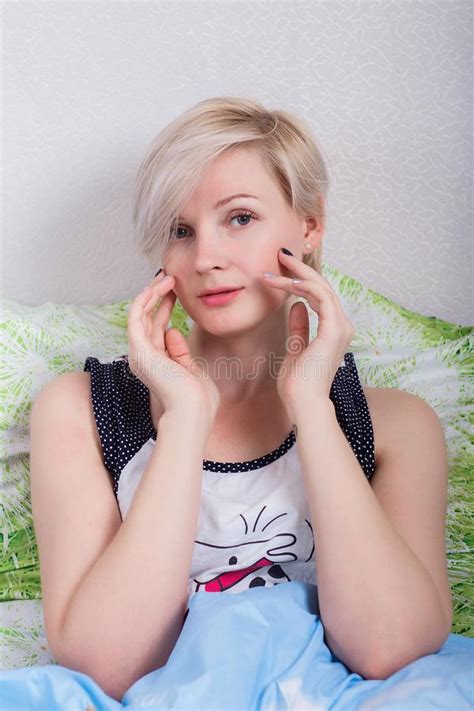 Pretty Blonde Woman Sitting On The Bed Stock Photo Image Of Homey