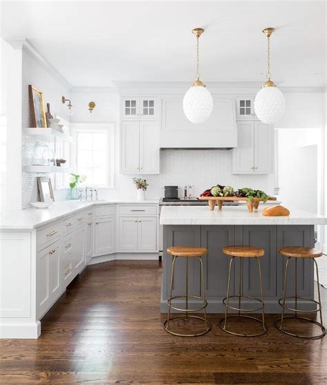 Hardwood floors in a kitchen are simply gorgeous. Dark Gray Cabinets With Light Wood Floors - Home Alqu