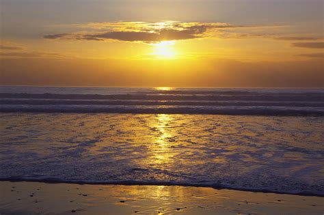 Sunset Over The Pacific Ocean Along The Photograph By Craig Tuttle