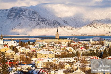 Downtown Reykjavik With Mountains In Stock Photo