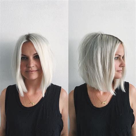 This Platinum Soft Blend Bob With Loose Wavy Texture And Shadow Roots Is A Great Modern Haircut