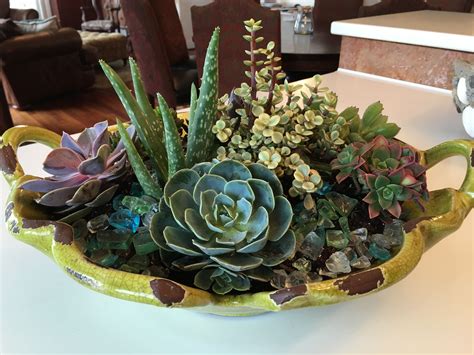 Unique Containers And A Variety Of Succulent Textures Make A Pretty
