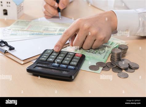 real estate contract hand motion utility bill calculation Stock Photo