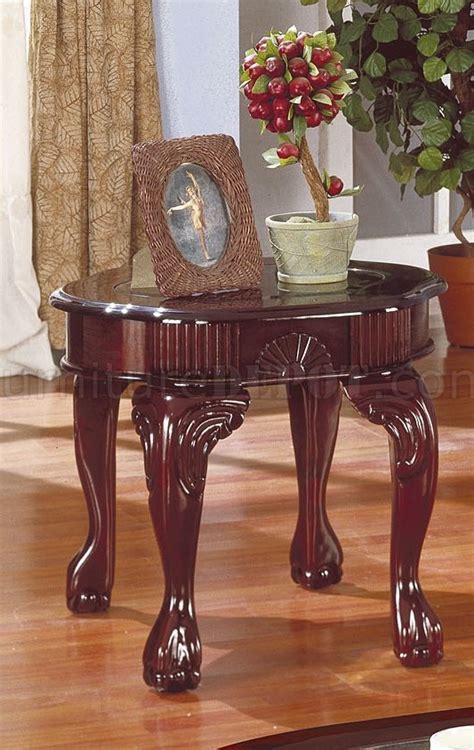 It is in excellent condition. Rich Cherry Traditional 3Pc Coffee Table Set w/Glass Inserts