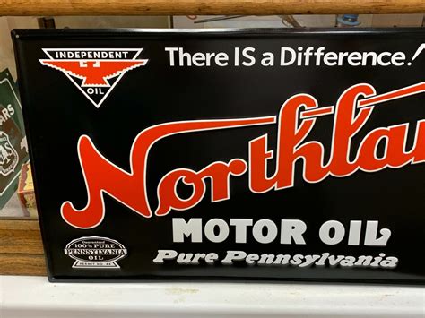 Northland Motor Oil Embossed Metal Sign 295x 155 Excellent