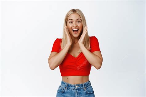 Premium Photo Super Excited Blond Girl Screams Smiles And Looks