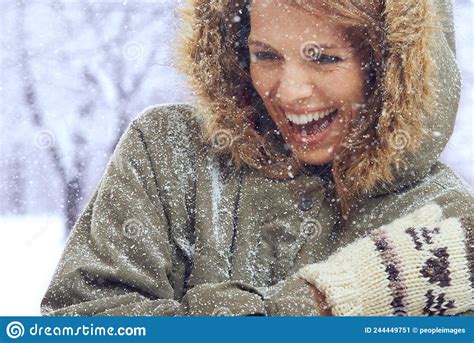 Loving The First Snowfall Shot Of An Attractive Woman Enjoying Herself