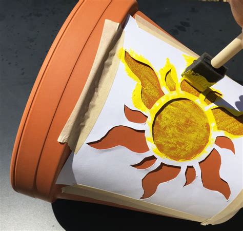 Flowers are like emissaries of beauty, greeting viewers with their myriad forms and colors. Tangled Golden Sun Flower Pot | Disney Family | Painted ...