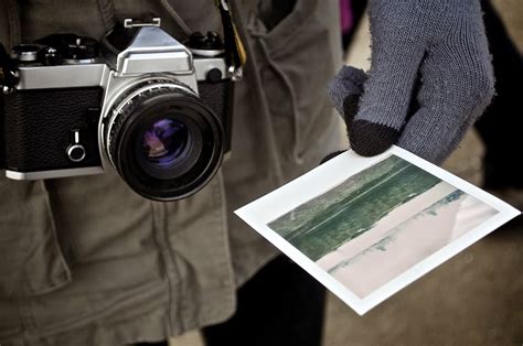 Person Holding Landscape Photo Gray Black Bridge Camera Paper