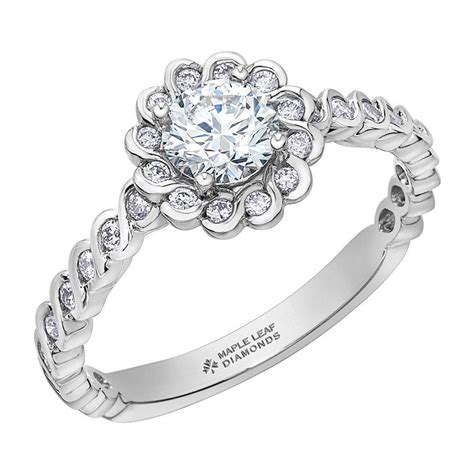 With accent diamonds in a halo design. Maple Leaf Diamonds 18ct White Gold Diamond Halo Ring ...