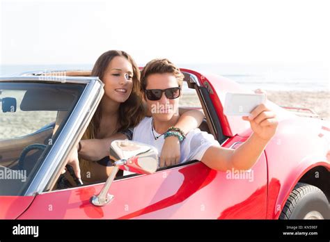 Couple In Red Sports Car Hi Res Stock Photography And Images Alamy