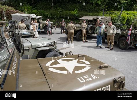 American Military Vehicles And Reenactors In Uniform Parked For The
