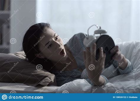 Shocked Woman Waking Up Late In The Morning Stock Photo Image Of