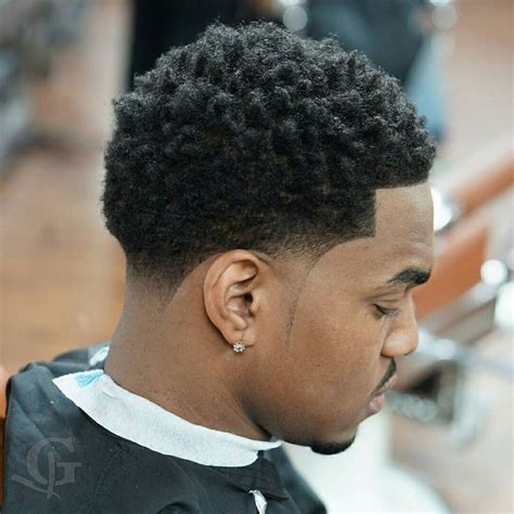 This style has a high fade on the sides with a bald fade around the ear that tapers up to a longer mop on top. 500+ best "BLACK MEN HAIRCUTS" images by Robin Davis on ...