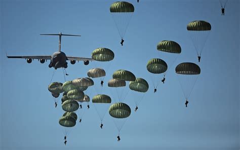 Paratroopers Carry Reserve Chutesand Sometimes Flotation Devices