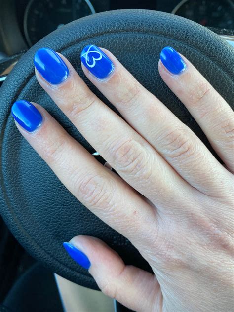 Cobalt Blue Nails With Heart Design On Ring Finger Vibrant Guide