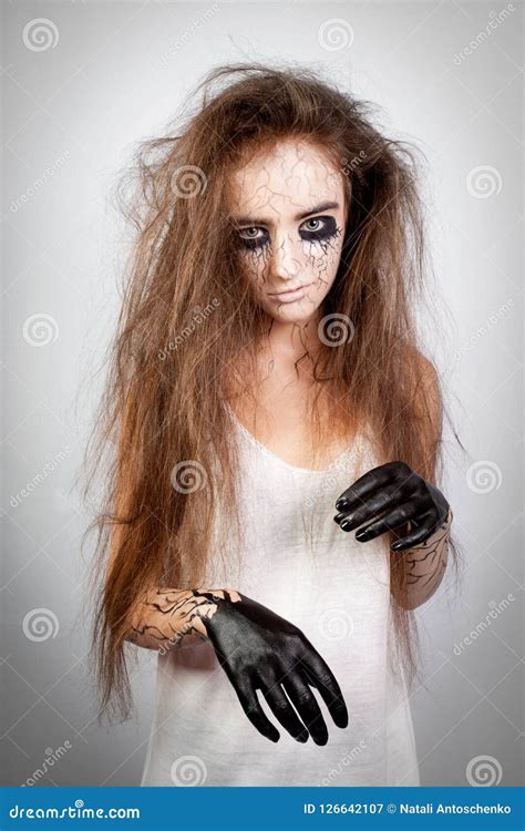 Crazy Girl With Disheveled Hair Black Eyes And Veins Concept Of Halloween And Day Of The Dead