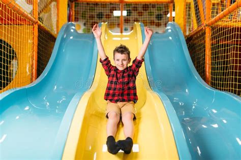 Boy Riding From Childrens Slides On Playground Stock Image Image Of