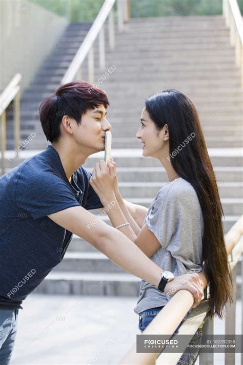 asian girl kissing telegraph